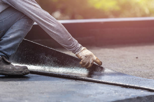 Professional Waterproofing technician working in Lake George, MI